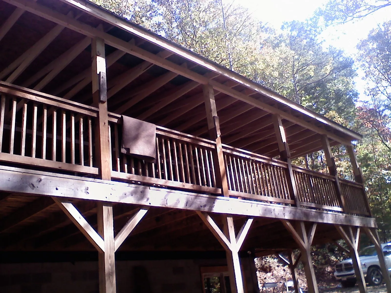 Timber framing under a new elevated porch and deck — Roof Leak Repair in Middlebury by Roofing Brothers